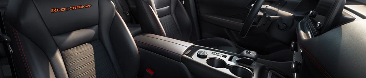 The center console of the 2025 Nissan Rogue in Pompano Beach, FL